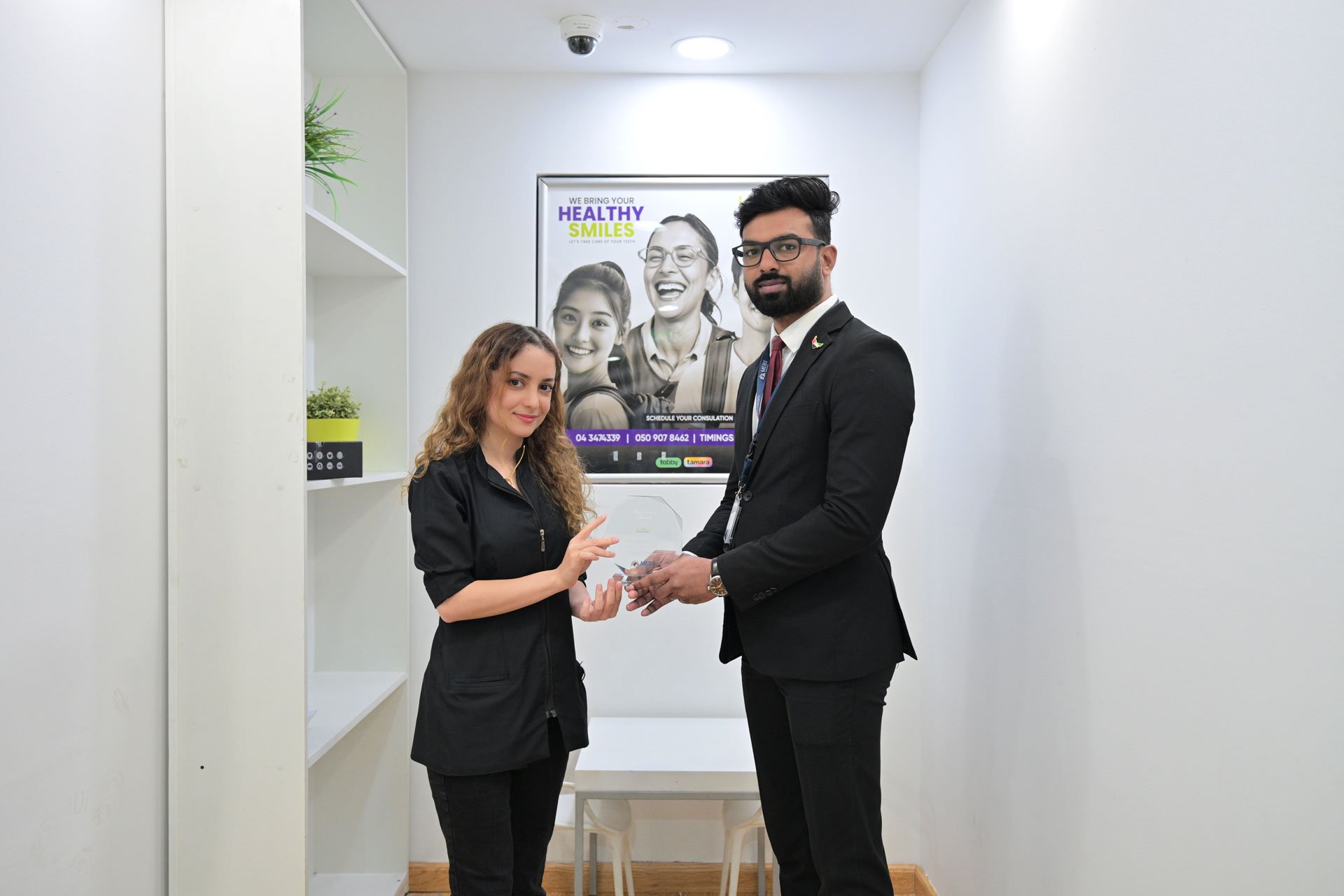 Corporate appreciation ceremony as MEBS Facility Services honors the dental clinic for community dental care support