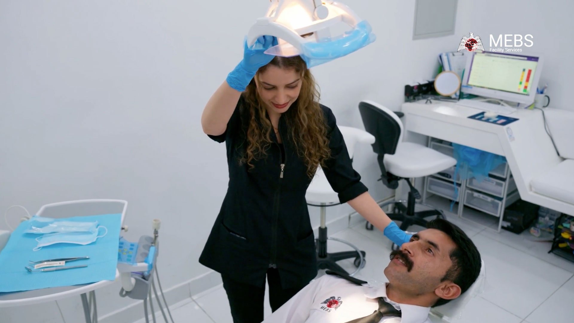 Licensed dentists conducting preventive dental examinations during MEBS community wellness initiative