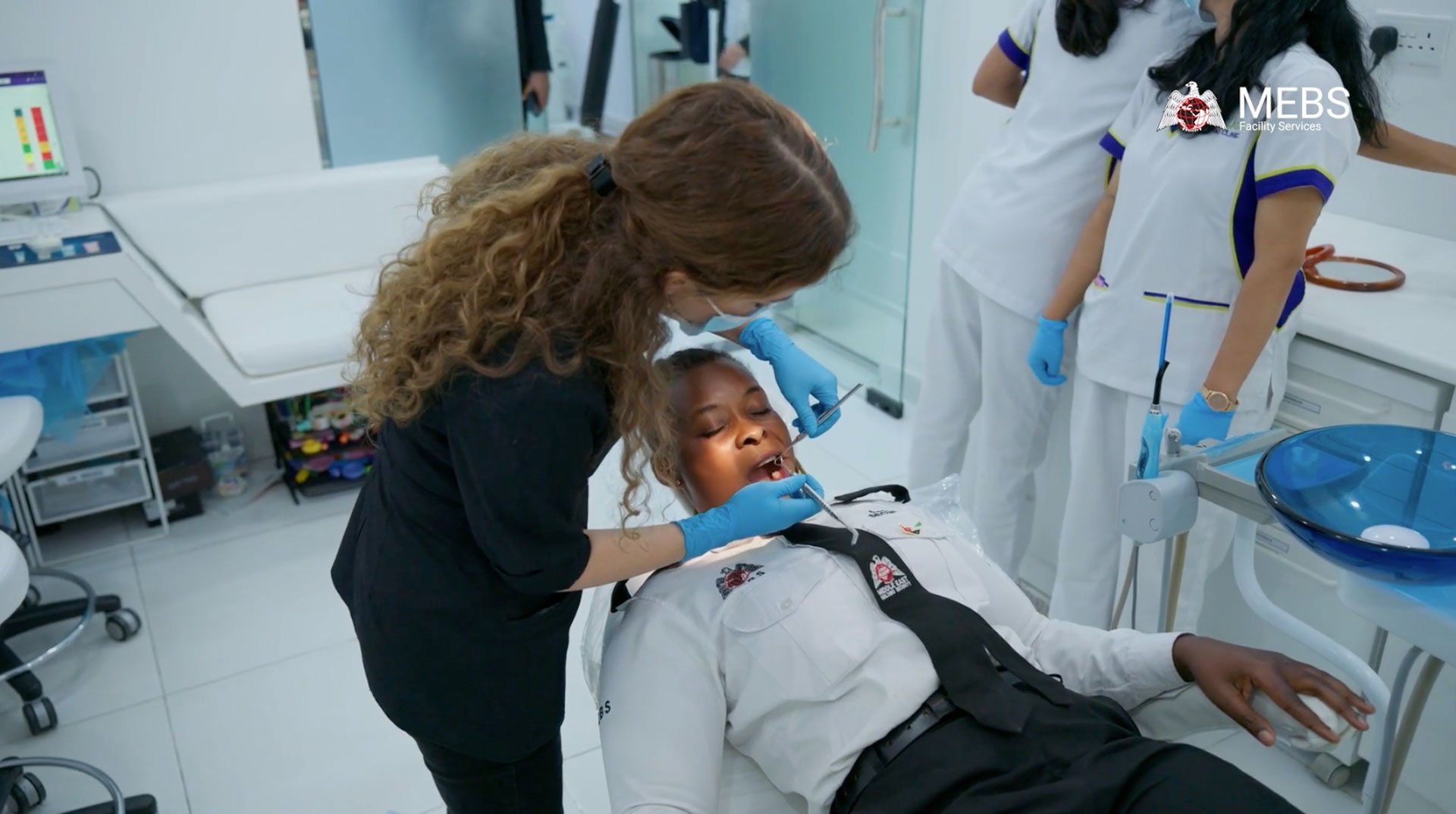 MEBS employees receiving professional dental screening during the CSR health initiative in Dubai